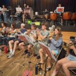 Children playing trumpets at summer residential course in Monmouth